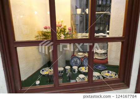 An antique window where a story seems to be born An antique window where a story seems to be born 124167784