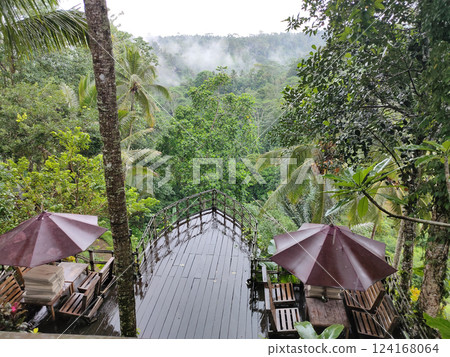 Traditional Bali style outdoor cafe in Ubud with view on forest, Bali, Indonesia 124168064