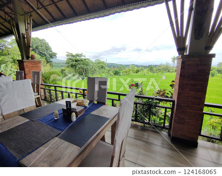 Traditional Bali style outdoor cafe in Ubud with view on forest, Bali, Indonesia Traditional Bali style outdoor cafe in Ubud with view on forest, Bali, Indonesia 124168065