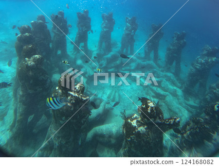 The underwater sculpture group the Nest near Gili Meno Island, a popular tourist spot for underwater The underwater sculpture group the Nest near Gili Meno Island, a popular tourist spot for underwater 124168082