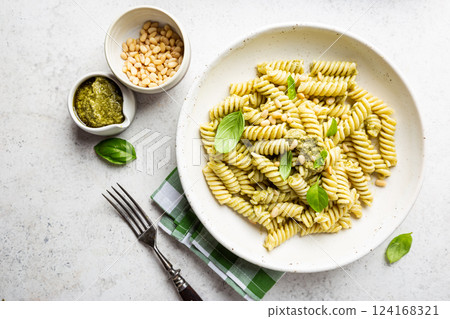 Fussili pasta with basil pesto 124168321