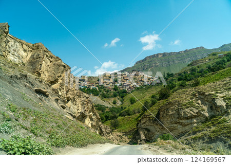 Village of Chokh in Dagestan. Facades of houses located in tiers on a steep slope, summer landscape. 124169567