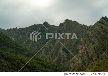Caucasian mountain. Dagestan. Trees, rocks, mountains, view of the green mountains. Beautiful summer landscape. Caucasian mountain. Dagestan. Trees, rocks, mountains, view of the green mountains. Beautiful summer landscape. 124169591