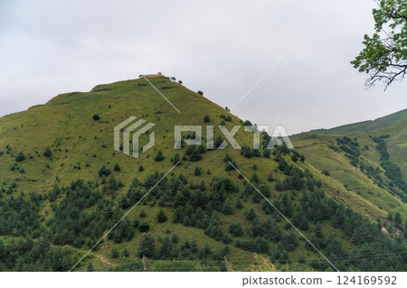 Caucasian mountain. Dagestan. Trees, rocks, mountains, view of the green mountains. Beautiful summer landscape. Caucasian mountain. Dagestan. Trees, rocks, mountains, view of the green mountains. Beautiful summer landscape. 124169592
