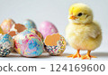 cute little chicken next to painted eggs, easter, bird, farm, holiday, domestic animal, ornithology, avian, chick 124169600
