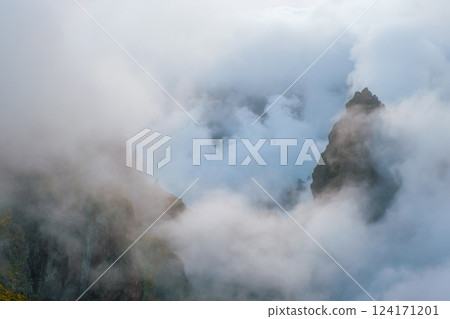 A mountain covered in fog and clouds. Madeira island, Portugal 124171201