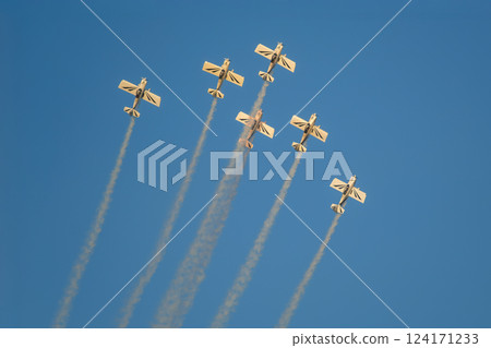Stunt aerobatic planes performing stunts in air 124171233