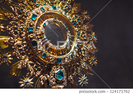 Gold rosette with emeralds from Christianity in shape of crown, medieval jewelry 124171702