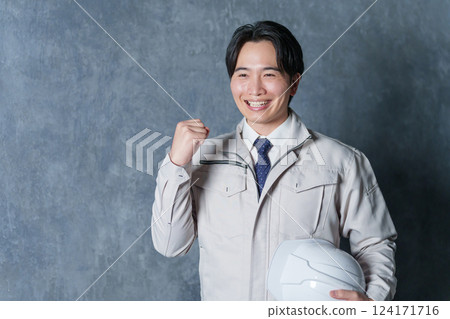 Businessman wearing work clothes (real estate/construction worker) 124171716