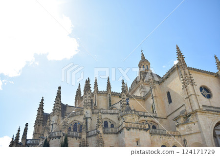 Gothic Cathedral of Segovia with pinnacles and architraves and lobed arches 124171729
