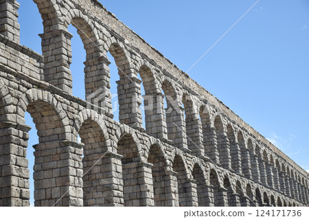 Right side view of Segovia Aqueduct, Roman construction for transporting water 124171736