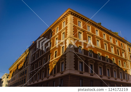 Historic Building Illuminated by Golden Hour Light in the city of Rome  124172219