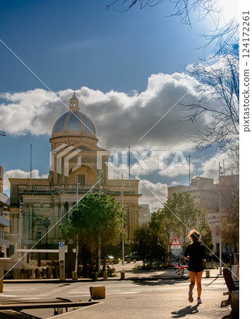 Historic Dome Church in city Kalkara country Malta with Jogger on a Sunday Historic Dome Church in city Kalkara country Malta with Jogger on a Sunday 124172261