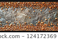 Buckwheat Seeds on Textured Stone Background Buckwheat Seeds on Textured Stone Background 124172369