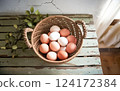 Natural Farmhouse Eggs in a Woven Basket Country Charm Natural Farmhouse Eggs in a Woven Basket Country Charm 124172384