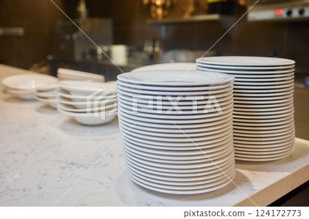 Beautifully Stacked Plates Arranged in a Contemporary Modern Kitchen Environment Setting Beautifully Stacked Plates Arranged in a Contemporary Modern Kitchen Environment Setting 124172773
