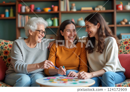 Women Enjoying Game Night Together in Cozy Living Room Filled With Colorful Decor and Laughter 124172909