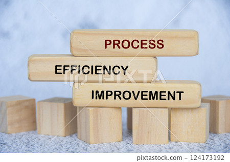 Process efficiency improvement text on wooden blocks. Strategic business concept 124173192