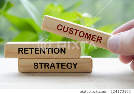 Customer Retention Strategy text on wooden blocks. Customer retention Strategic and business concept Customer Retention Strategy text on wooden blocks. Customer retention Strategic and business concept 124173193