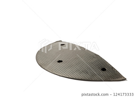 Detailed View of a Metallic, Textured Plate with Multiple Holes That Appears to be Engineered for Specialized Mechanical Applications or Fixtures 124173333