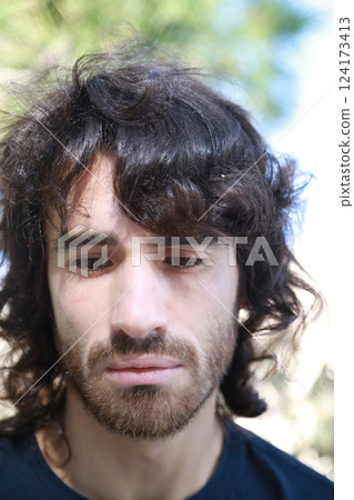 Sad Long Hair Man Is About To Cry From Depression In The Nature Park Sad Long Hair Man Is About To Cry From Depression In The Nature Park 124173413
