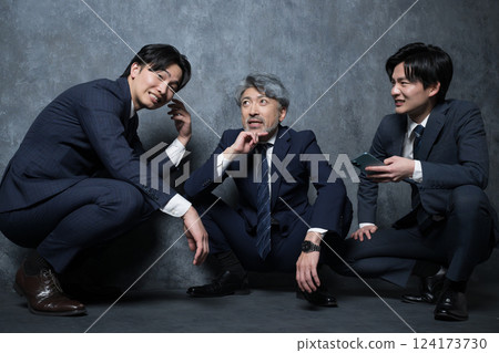 An image of internal politics between bosses and subordinates discussing rumors about transfers and demotions. Office worker: "Is that true?" 124173730