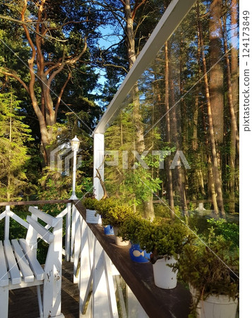 Terrace with white chairs in the forest 124173849