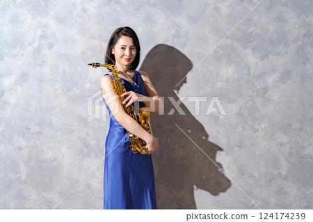 Woman with saxophone 124174239