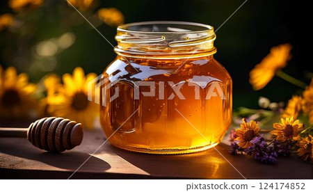 A jar of fresh natural honey and flowers 1 A jar of fresh natural honey and flowers 1 124174852