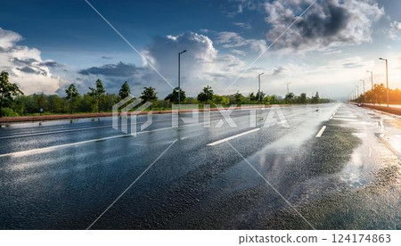 Asphalt road after rain and reflected sky 2 124174863