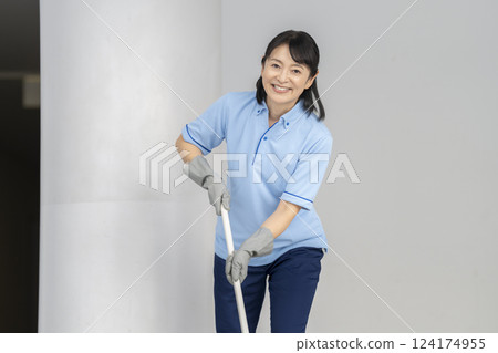 Female cleaning staff in her 50s looking at camera, portrait 124174955