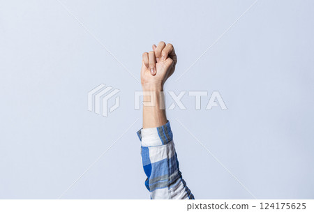 Hand gesturing the letter N in sign language on an isolated background. Man's hand gesturing the letter N of the alphabet isolated. Letter N of the alphabet in sign language Hand gesturing the letter N in sign language on an isolated background. Man's hand gesturing the letter N of the alphabet isolated. Letter N of the alphabet in sign language 124175625