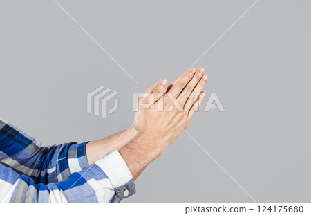 Two hands together in prayer position. Two hands together in prayer on isolated background. Concept of prayer and hands together. Two hands together thanking or asking for forgiveness Two hands together in prayer position. Two hands together in prayer on isolated background. Concept of prayer and hands together. Two hands together thanking or asking for forgiveness 124175680