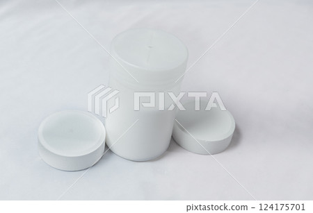 Chlorine tablets for swimming pool disinfection on white background, swimming pool cleaning and maintenance chlorine tablets. Chlorine tablets for pool cleaning on isolated background 124175701