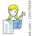 A smiling elementary school girl shows off a test she got 100 points on (simple) 124176018