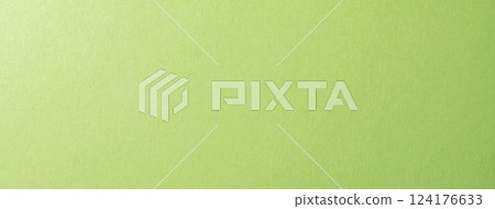 Textured yellow-green paper background texture 124176633