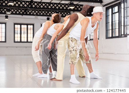 Dancers is doing exercises in class 124177445