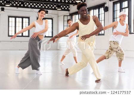 People dancing lindy hop during group training in class People dancing lindy hop during group training in class 124177537
