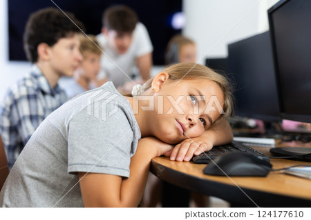 Girl student sleeps while sitting at computer 124177610