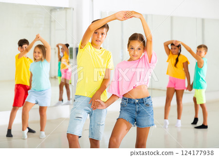 Portrait of children enjoying of partner dance in class Portrait of children enjoying of partner dance in class 124177938