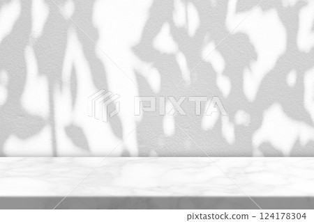 White Marble Table with Tree Shadow on Concrete Wall Texture Background White Marble Table with Tree Shadow on Concrete Wall Texture Background 124178304