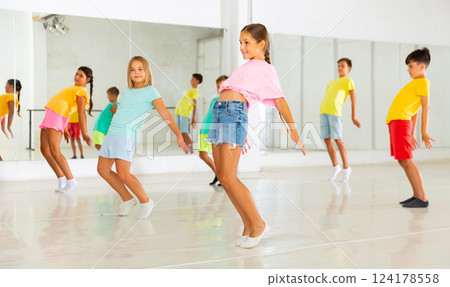 Group of kids training modern dance moves 124178558