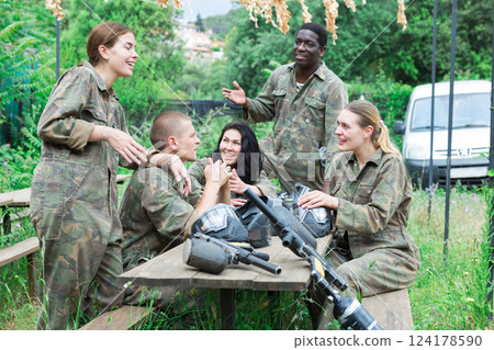 Men and women share their impressions of playing paintball Men and women share their impressions of playing paintball 124178590