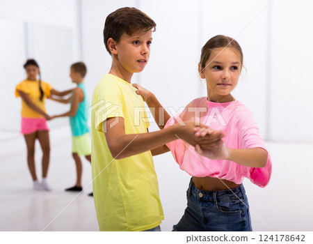 Active young children enjoying of partner dance in class 124178642