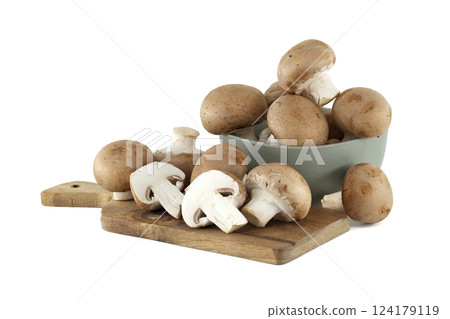Rustic wooden board displays fresh cremini mushrooms alongside bowl overflowing with earthy delights Rustic wooden board displays fresh cremini mushrooms alongside bowl overflowing with earthy delights 124179119