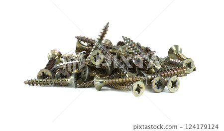 Heap of self-tapping screws sits on white, commonly used in various construction and woodworking 124179124