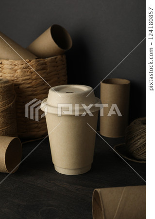 Twine, basket and paper cup on gray background, close up 124180857