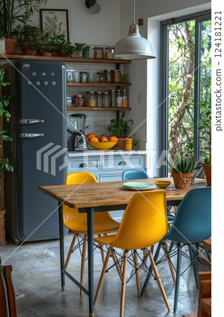 Modern kitchen with vibrant chairs and a rustic wooden dining table 124181221