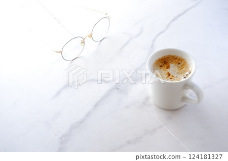 Image of a person relaxing while drinking a cafe latte, a mixture of espresso and milk Image of a person relaxing while drinking a cafe latte, a mixture of espresso and milk 124181327