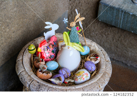 Easter decoration with Easter eggs and Easter bunnies in a pot Easter decoration with Easter eggs and Easter bunnies in a pot 124182352
